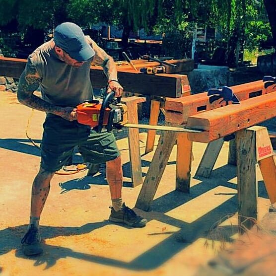 Petaluma home, Jeremy Ford with chainsaw